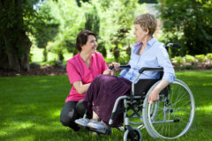 caregiver and senior on a wheelchair